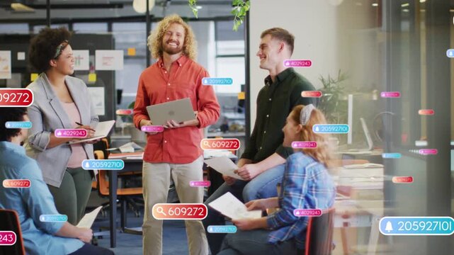 Presenter gesturing and initiating floating data labels over laptop and pages for business meeting