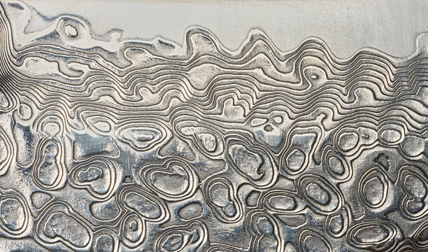 Macro surface of the Damascus steel blade with a unique wavy pattern