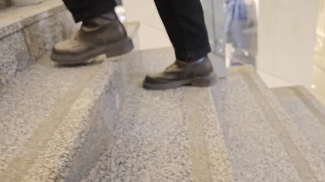 Climbing stairs inside a shopping mall during a busy afternoon