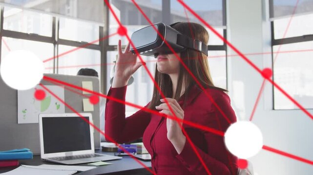 Woman adjusting VR headset at desk, activating red network and testing interface for technology
