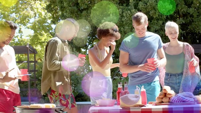 Group of five meeting, grill tending food sparking sharing plates, bokeh marking red cups