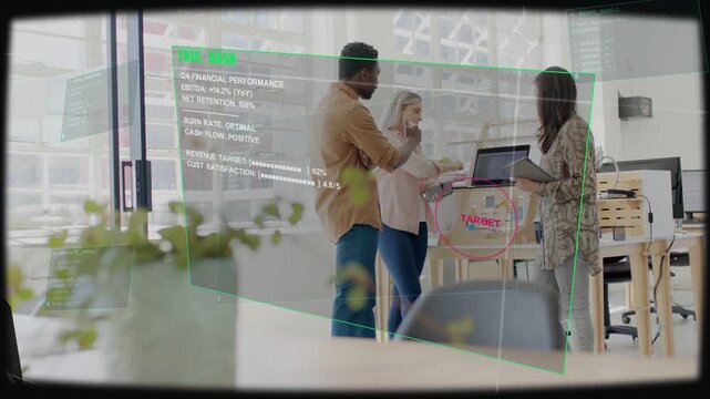 Trio at table reviewing finance metrics, woman flipping laptop revealing green hologram TARGET
