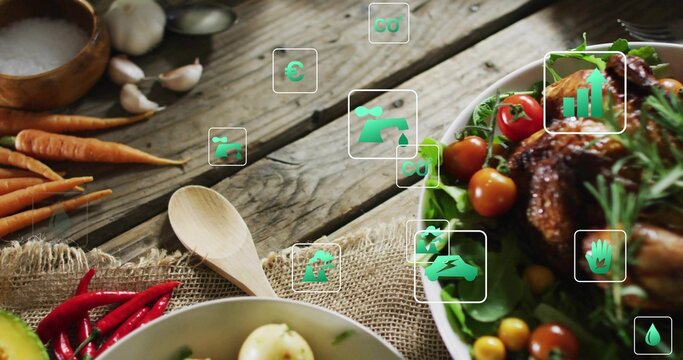 Featuring white bowl with roasted chicken salad on farmhouse tabletop, wooden spoon, green icons