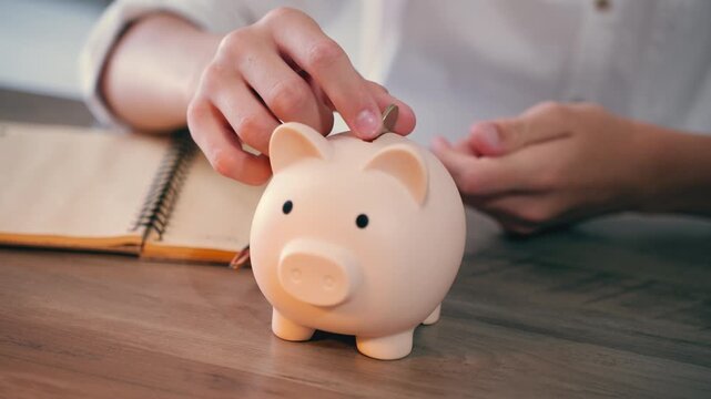 Saving coins in piggy bank during economic crisis, budgeting and financial control, inflation concept, cost of living and personal savings.