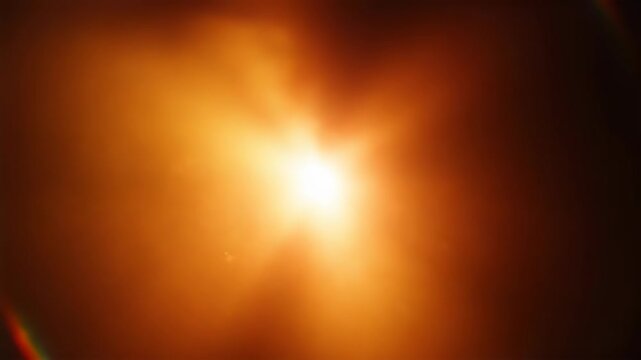 Bright blue light beam shining through dark space with lens flare