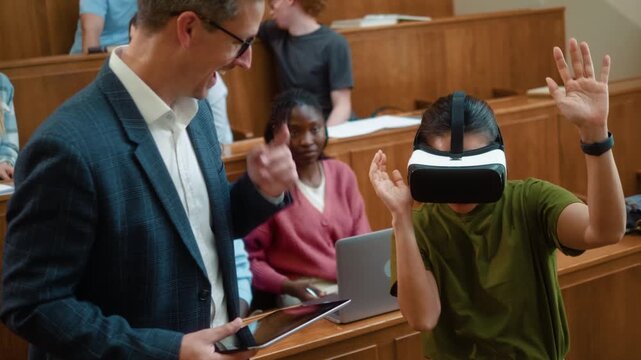 Korean female student reacts with surprise and excitement while using VR headset during university class as professor guides experience with digital tablet.