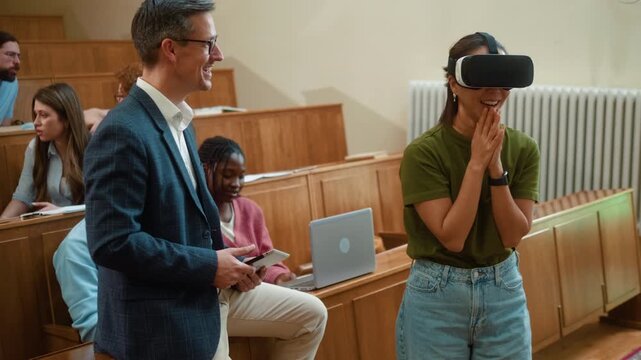 Korean female student shows delighted expression while using VR headset in university class as professor guides with tablet. Diverse students observe education technology.