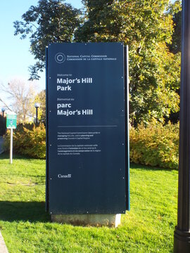 Ottawa, Ontario, Canada &ndash; August 02, 2025: A dark blue welcome sign for "Major's Hill Park" stands in a lush green park on Sussex drive.
