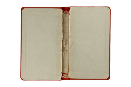Open vintage book cover interior with worn fabric spine, aged paper lining, and red cloth border, isolated on black background. Antique bookbinding detail suitable for restoration, archival