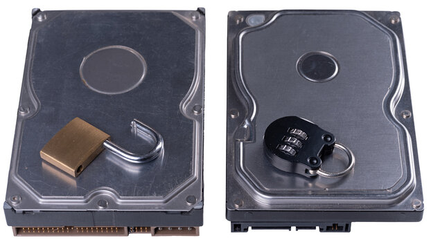 Two classic hard drives. One with an open padlock, the other with a closed padlock. Background is textured.