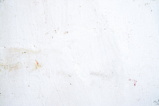 Plaster applied on a wall surface prepared for repair with visible texture and uneven layers. Construction process, home renovation, and maintenance work scene.