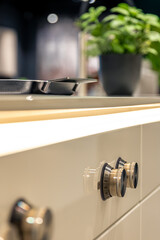 Naklejka premium Minimalist kitchen furniture details. Glossy panels with lights and knobs.
