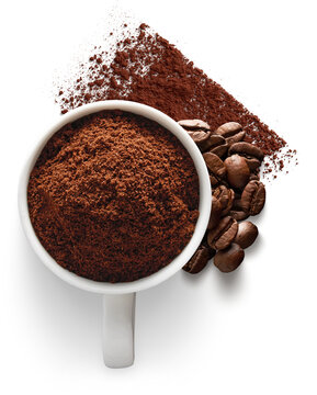 White cup filled with ground coffee and roasted beans isolated on transparent background