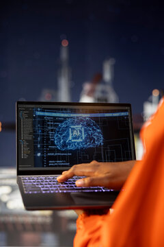 Close up of offshore platform expert using AI deep learning to analyze oil extraction efficiency. Engineer on drilling rig configuring management systems with artificial intelligence neural network