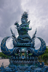 Fototapeta premium Vibrant Blue Temple Wat Rong Suea Ten with ornate gold details in Chiang Rai, Thailand