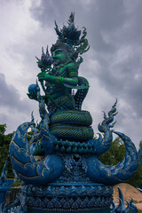 Fototapeta premium Vibrant Blue Temple Wat Rong Suea Ten with ornate gold details in Chiang Rai, Thailand