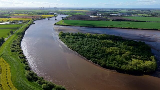 Aerial view of Howden Dyke Island on the River Ouse with the M62 bridge and green fields Goole, England, United Kingdom.