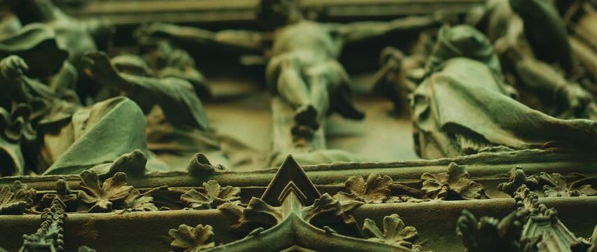 Detailed bronze crucifixion of Jesus Christ sculpture on Milan Cathedral doors