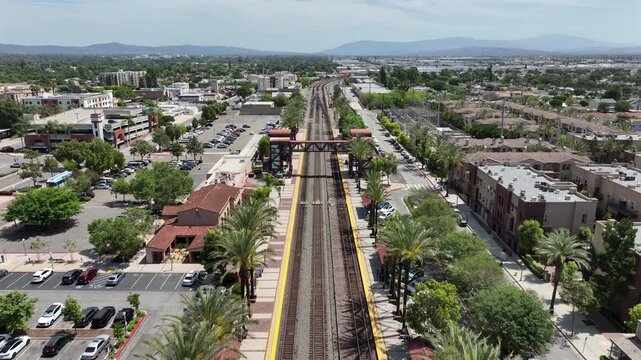 Fullerton, California, USA - Aerial View of Fullerton Transportation Center Train Station FUL in Downtown with Rail Tracks, Residential and Commercial Buildings