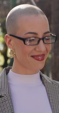 Businesswoman, walk or commute in park with phone, text message or good news for real estate work. Happy, female person and glasses outdoor with tech, mobile app notification or travel to realtor job