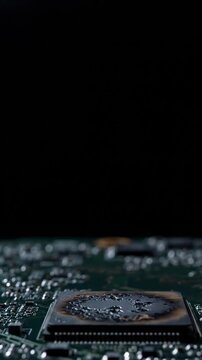 Close-up Macro Shot of a Damaged Burnt Computer Motherboard Circuit Board with Red Glare and Bokeh Effects