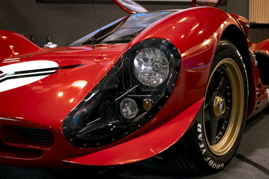 Front detail of a sports prototype with composite bodywork, faired headlight, slick tire and high-performance aerodynamics.