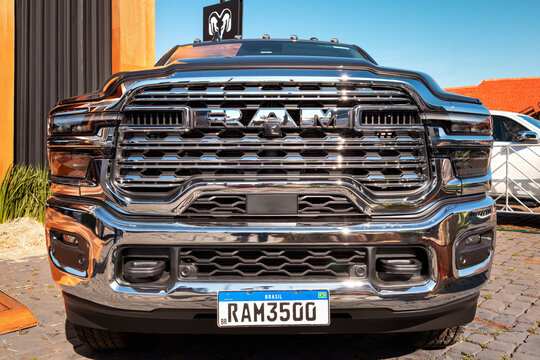 Front view of a RAM 3500 pickup with robust chrome grille, integrated LED headlights, and reinforced bumper.