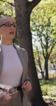 Business, late and running with woman in park for hurry or rush to appointment and schedule. Checking watch, time and urgency with employee person outdoor for delay, morning commute or travel