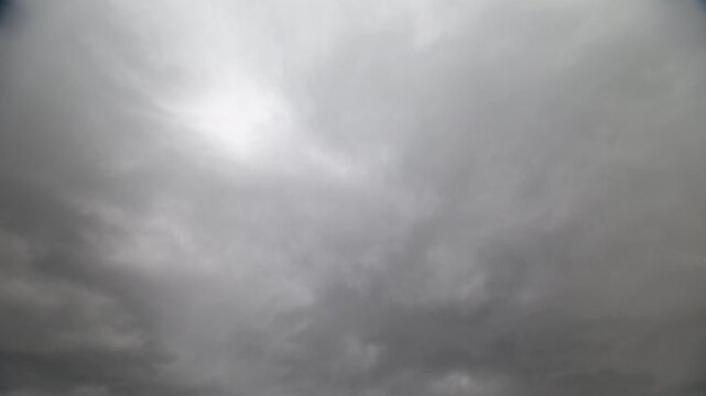 Stratocumulus clouds create moody atmosphere. Gray skies with dynamic cloud movement for visuals. Cinematic cloud sequences showcasing stormy layers with subtle lighting effects