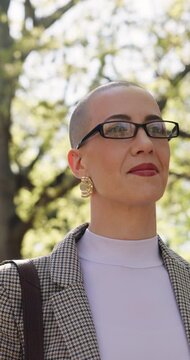 Businesswoman, walk and commute outdoor with vision, real estate career and entrepreneurship idea. Low angle, female person and realtor thinking with glasses, inspiration and travel journey for work.