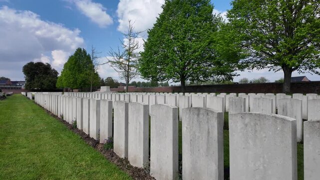 Row of white headstones in military cemetery