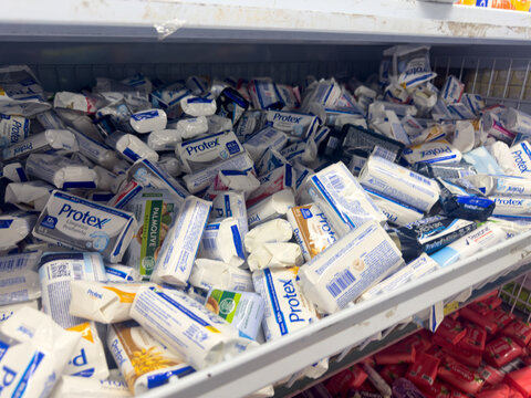 BELO HORIZONTE, MG, BRAZIL, APRIL 11, 2026 An overflowing display bin in a supermarket is filled with a variety of Protex and Palmolive soap bars.