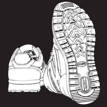 Pair of athletic sneakers with rugged tread on dark background.