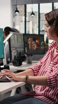 Vertical Video Woman editor using AI generative models for text to image commercial materials, virtual assistant writing script for photography generating next to video streaming platform on PC.