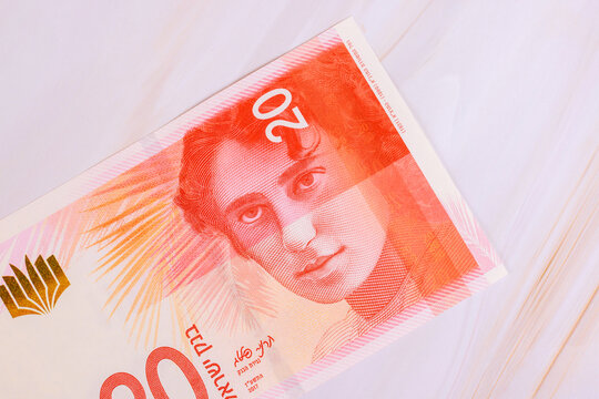 New Israeli twenty shekel currency note shows woman portrait against background of palm leaves