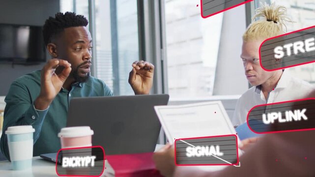 Two colleagues studying paper, presenter initiating security labels and explaining network flow