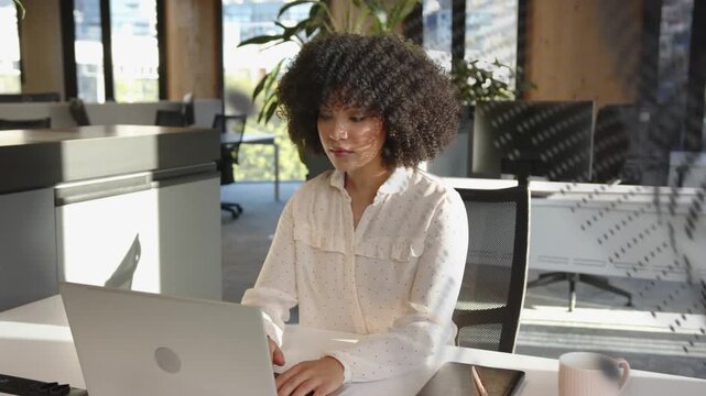 Woman typing, picking mug, reading paper as dot pattern sweeping across office checking data