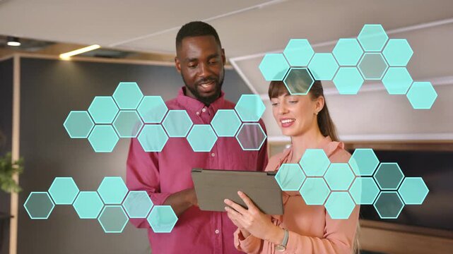 Man tapping tablet, woman scrolling, working in business lounge, teal hex overlay sweeping, smiling
