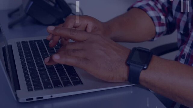 Mature man starting typing while working on office PC, fingers hovering, artifacts obscuring keys