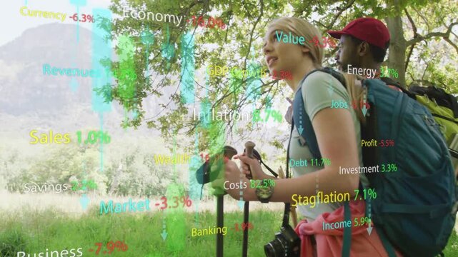 Woman and man hiking with poles, camera panning upward as finance graphs rising, scanning mountains