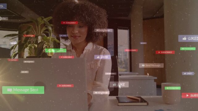 Woman typing at desk, initiating floating UI badges around laptop while tracking social engagement