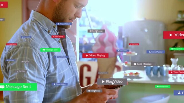 Man tapping smartphone in ice-cream shop, activating floating social message badges changing color