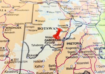Fototapeta premium View of Kanye, is a village in southern Botswana, located 83 kilometres south-west of the capital, Gaborone, on a geographical map of Africa, marked with red push pin