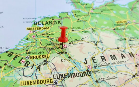 View of Dusseldorf, is the capital city of North Rhine-Westphalia, the most populous state of Germany, on a geographical map of Europa, marked with red push pin