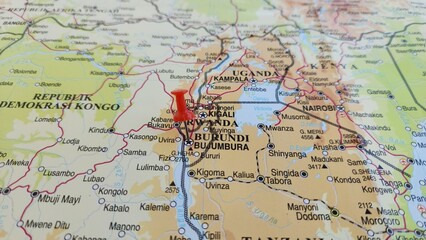 Naklejka premium View of Burundi, officially the Republic of Burundi, is a landlocked country in East Africa, on a geographical map of Africa, marked with red push pin