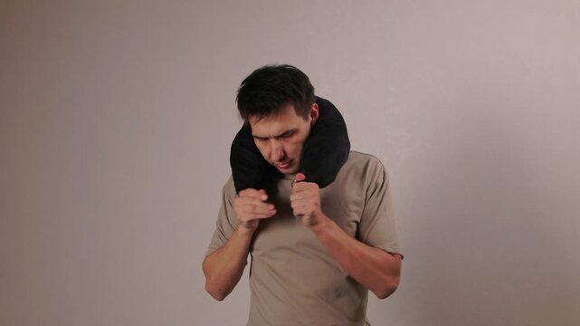 Inflatable neck support examination. Testing comfort and fit of travel neck pillow. Assessing effectiveness and comfort of inflatable neck support devices during travel