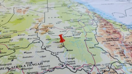 Naklejka premium View of Aweil, is a city located in South Sudan, It is the capital of Northern Bahr el Ghazal state, on a geographical map of Africa, marked with red push pin