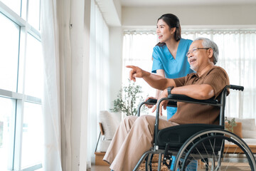 Obraz premium Elderly health insurance, older man wheelchair nurse bright home care smiling pointing window natural light indoor accessibility support rehabilitation comfort senior care patient caregiver living