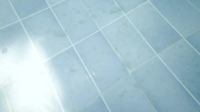 Dirty sediments on the bottom of swimming pool., Underwater
