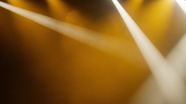 Radiant golden beam spotlight illuminating vibrant yellow background cinematic glowing effect for video production backdrop
